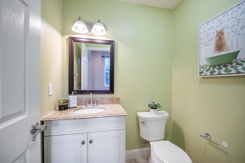 5813 Cajon Way Gilroy, CA 95020 - Photo 34 of 55 a bathroom with a toilet sink and mirror