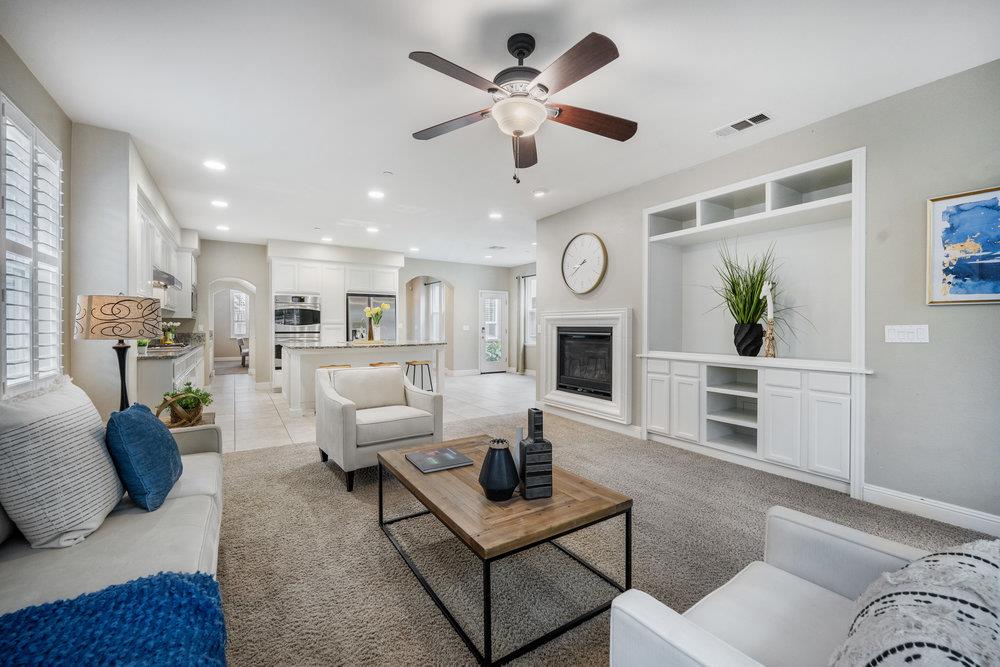 5813 Cajon Way Gilroy, CA 95020 - Photo 4 of 55 a living room with furniture a clock on wall and a window