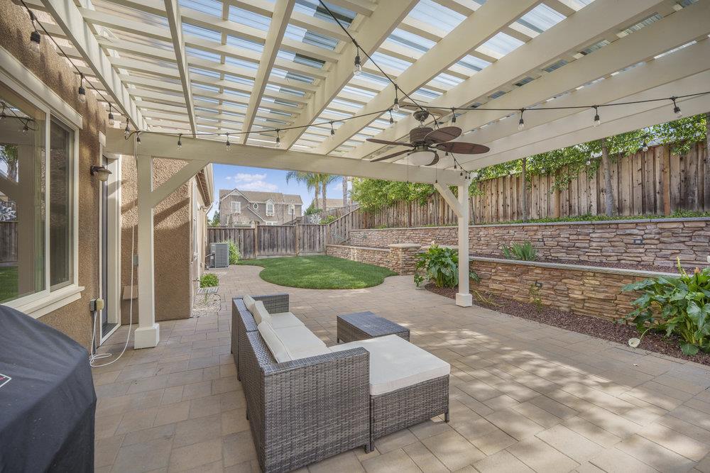 5813 Cajon Way Gilroy, CA 95020 - Photo 41 of 55 a view of a porch with furniture and a backyard