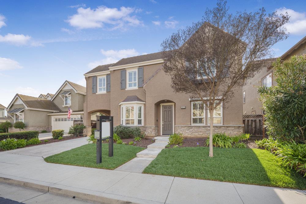5813 Cajon Way Gilroy, CA 95020 - Photo 42 of 55 a front view of a house with a garden and trees