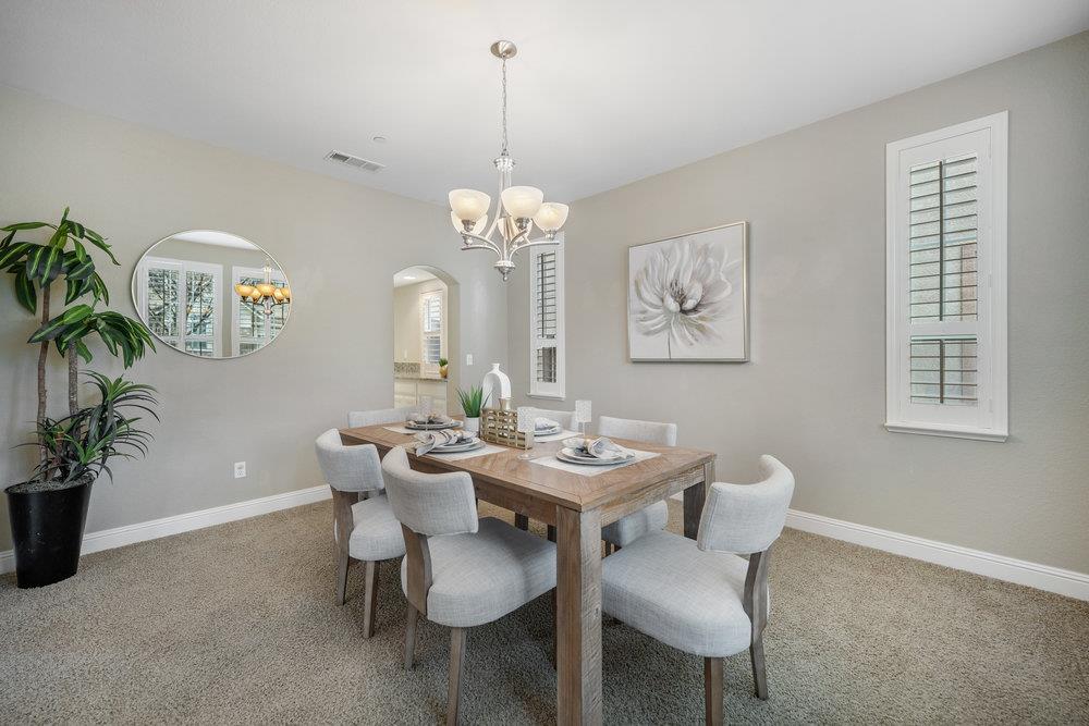 5813 Cajon Way Gilroy, CA 95020 - Photo 8 of 55 a view of a dining room with furniture and chandelier