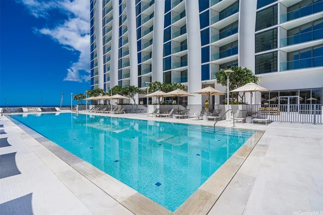 a view of swimming pool with outdoor seating and a patio