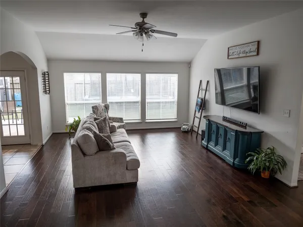 a living room with furniture and a flat screen tv