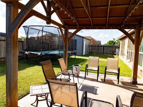 a view of swimming pool with outdoor seating