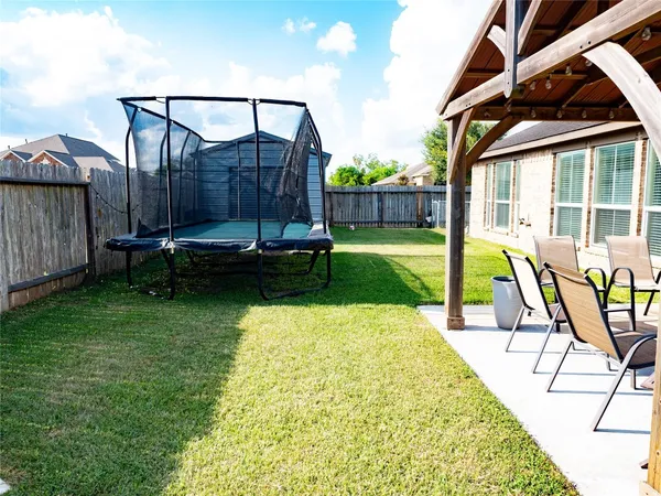 a view of swimming pool with a backyard