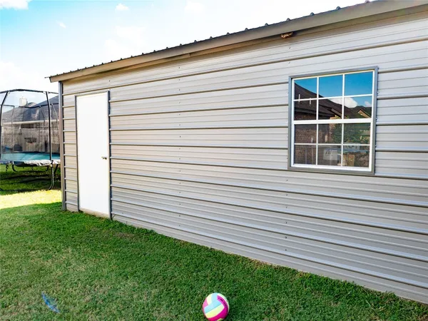 a view of a backyard with a garden