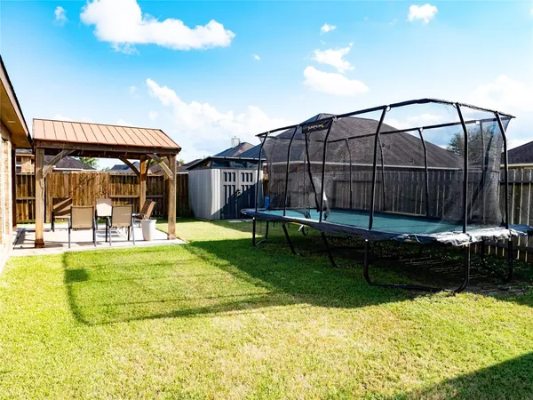 a view of a swimming pool with a yard