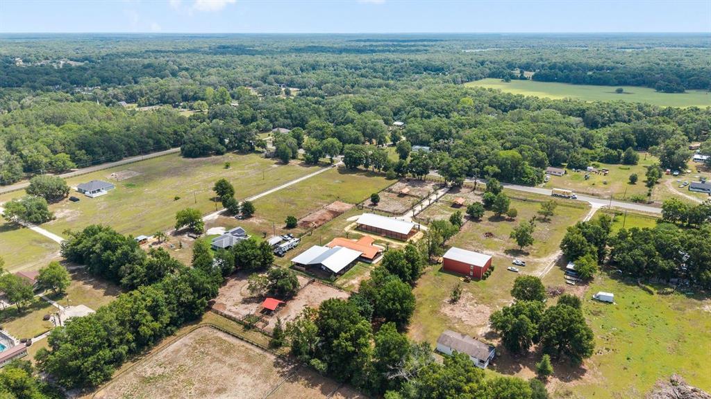 16392 Northeast Jacksonville Road Citra, FL 32113 - Photo 41 of 44 an aerial view of residential houses with outdoor space and trees