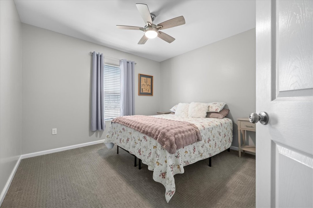 623 New Hope Road Anderson, SC 29626 - Photo 21 of 49 Soft wall-to-wall carpeting and natural light highlight this comfortable bedroom space.