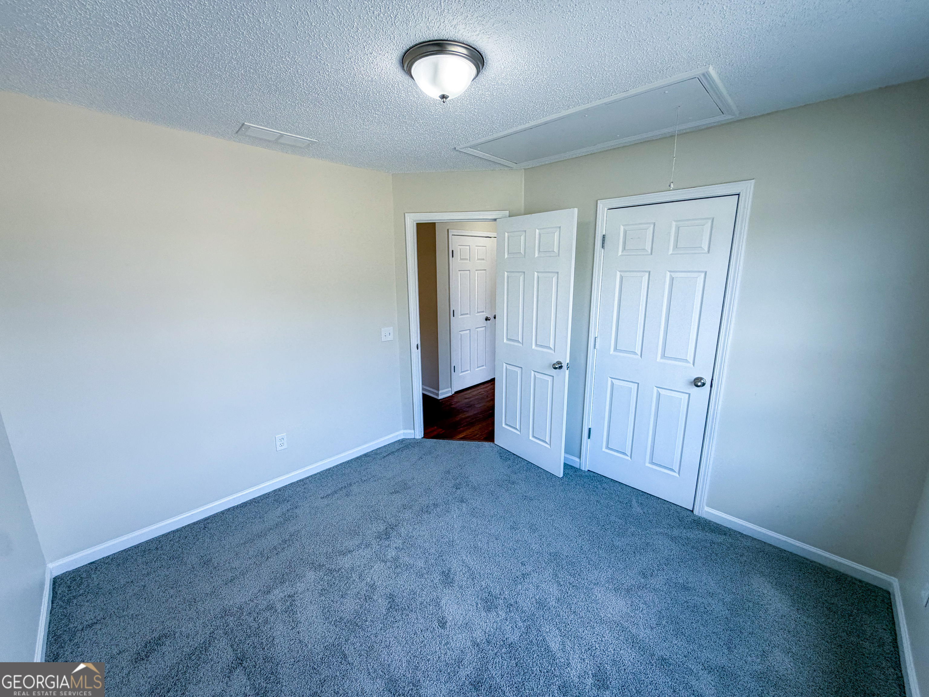 1119 Hummingbird Way Winder, GA 30680 - Photo 14 of 38 an empty room with closet area