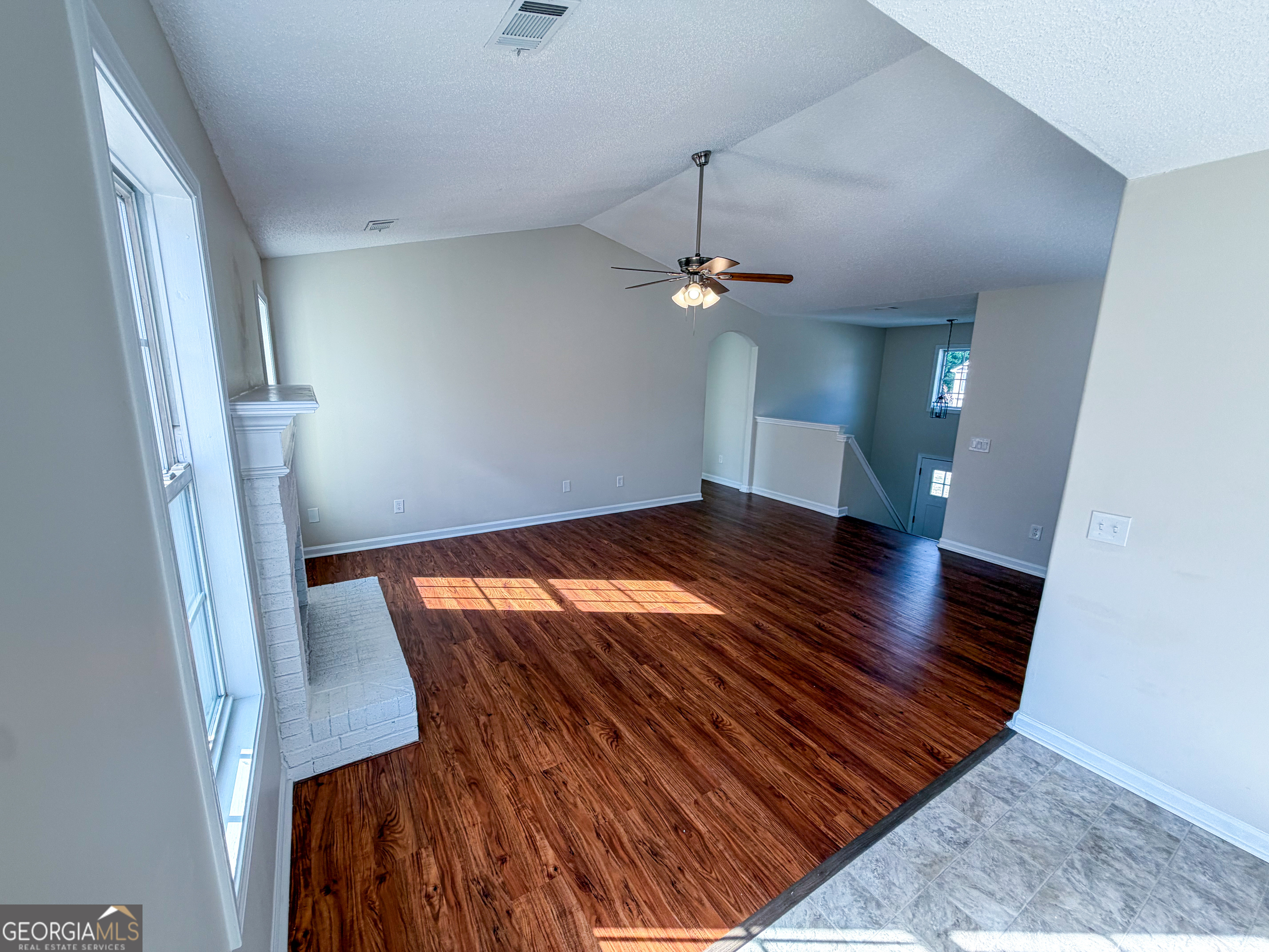 1119 Hummingbird Way Winder, GA 30680 - Photo 16 of 38 wooden floor in an empty room with a window