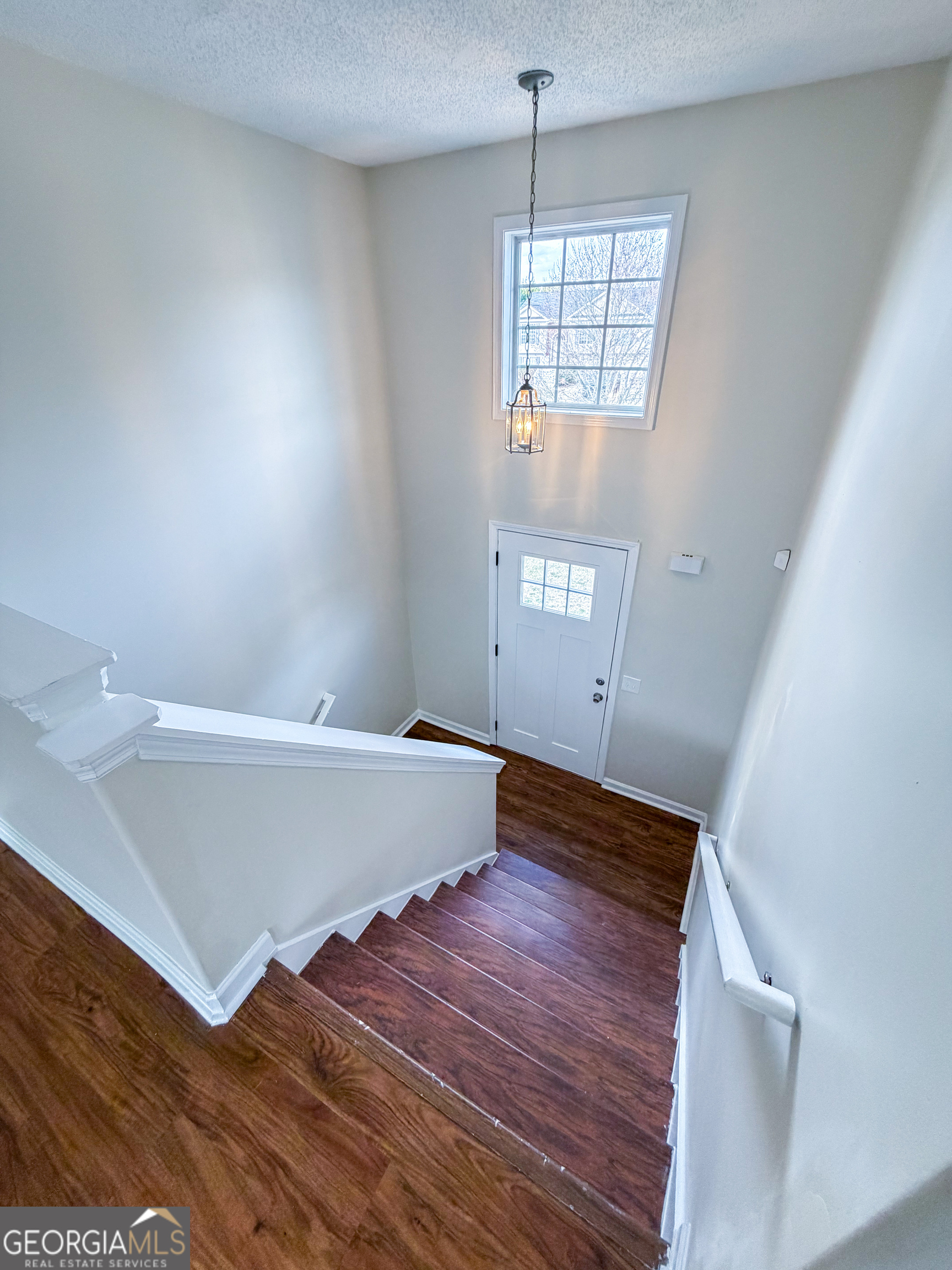 1119 Hummingbird Way Winder, GA 30680 - Photo 25 of 38 a view of an empty room with wooden floor and a window