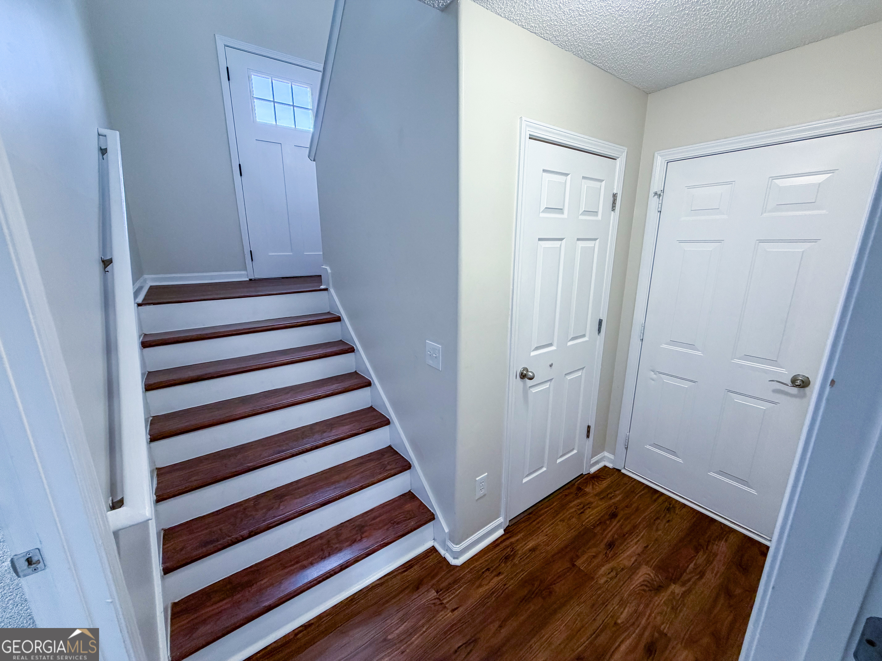 1119 Hummingbird Way Winder, GA 30680 - Photo 26 of 38 a view of a hallway with wooden floor and entryway