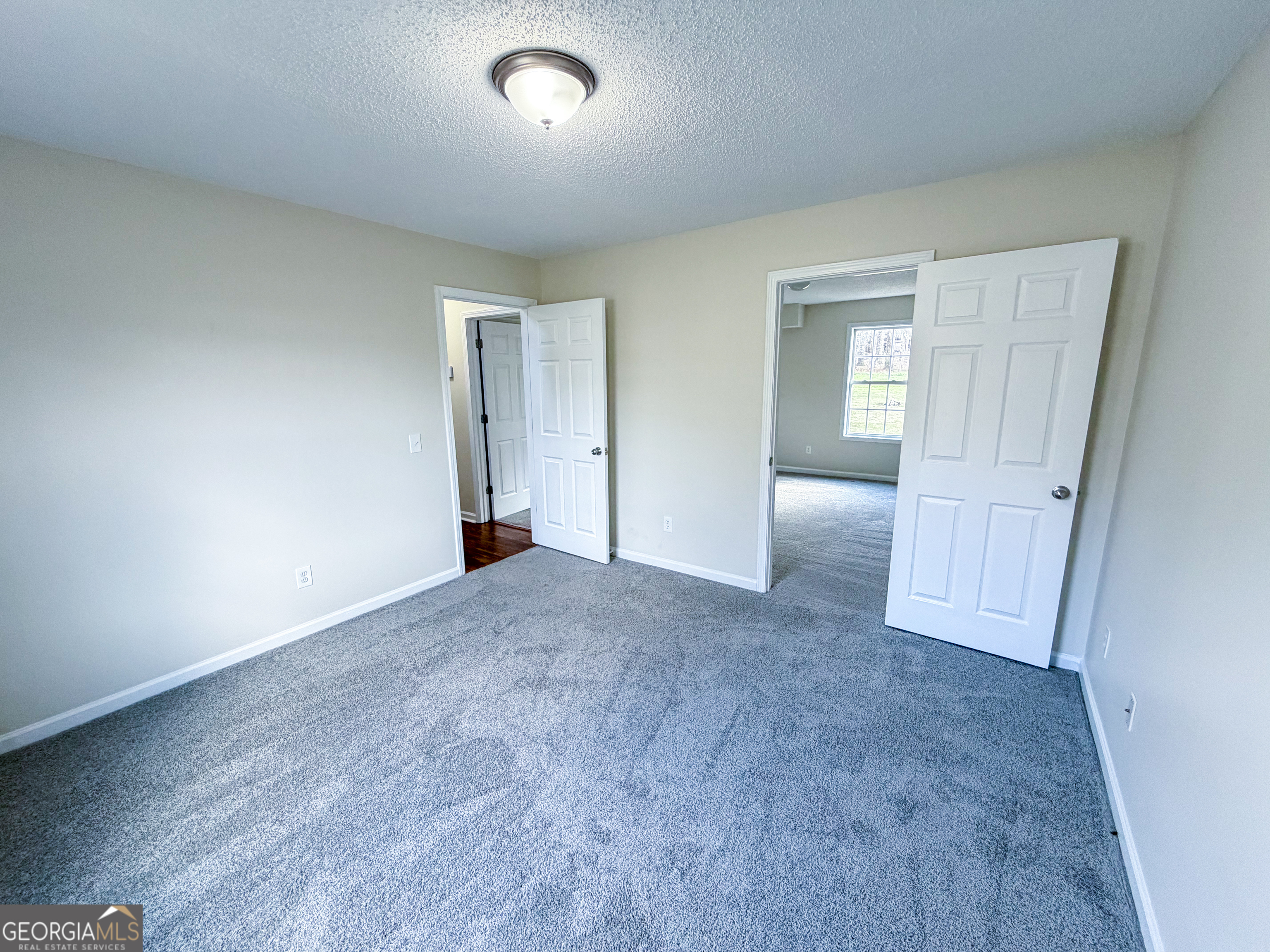 1119 Hummingbird Way Winder, GA 30680 - Photo 28 of 38 an empty room with a natural light