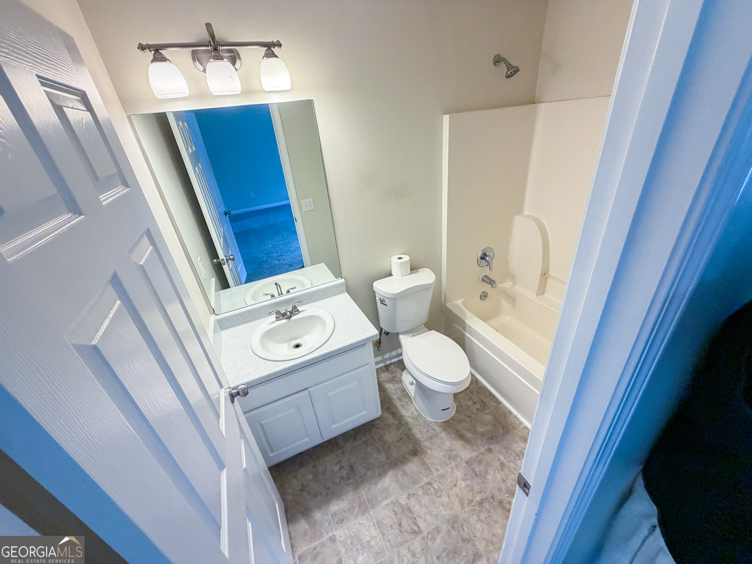 1119 Hummingbird Way Winder, GA 30680 - Photo 30 of 38 a bathroom with a toilet sink and mirror