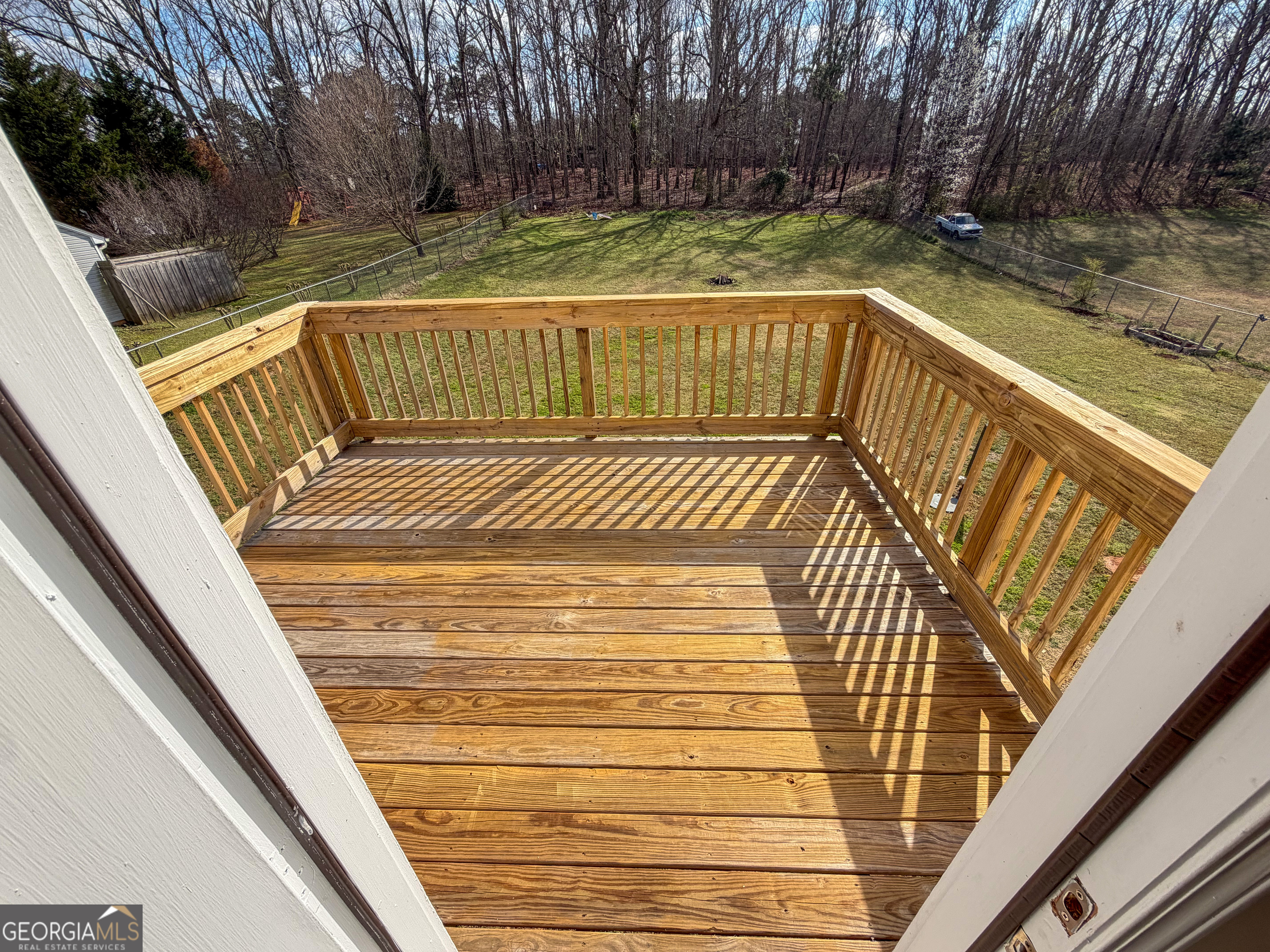 1119 Hummingbird Way Winder, GA 30680 - Photo 5 of 38 a view of deck with wooden floor and outdoor seating