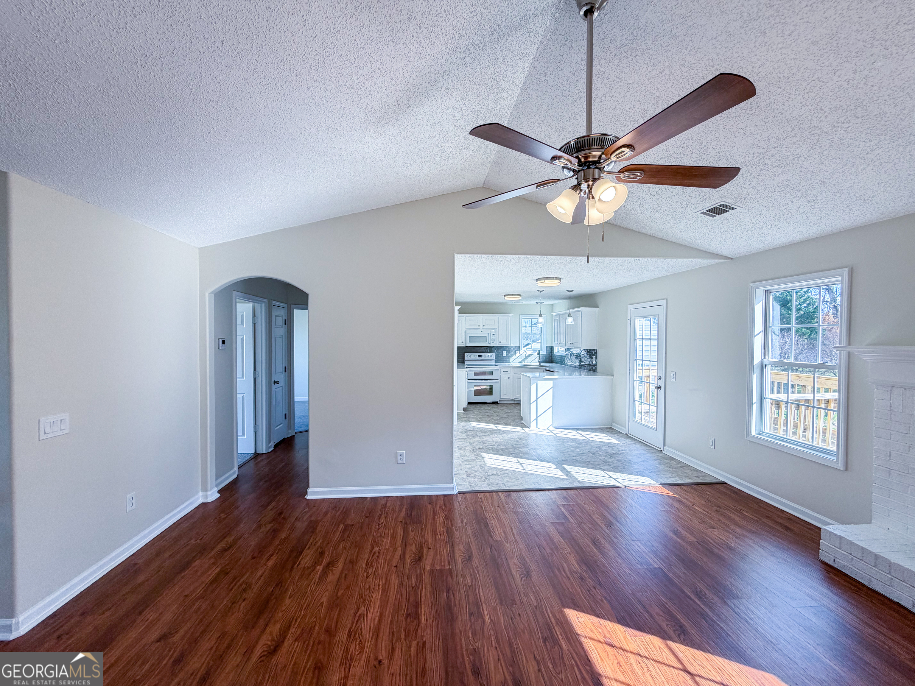 1119 Hummingbird Way Winder, GA 30680 - Photo 8 of 38 a view of an empty room with window and wooden floor