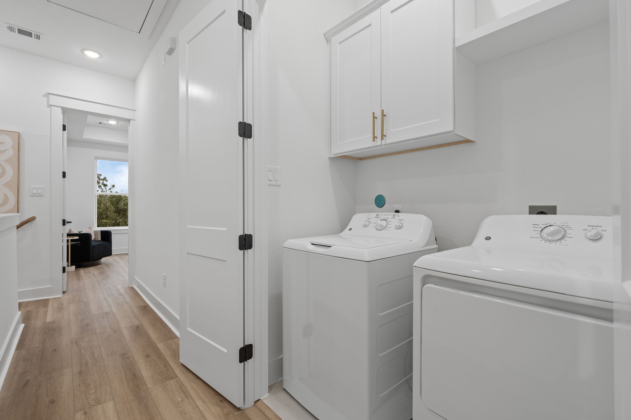 717 Janisch Road, Unit I Houston, TX 77018 - Photo 12 of 19 a bathroom with a sink and a washer dryer