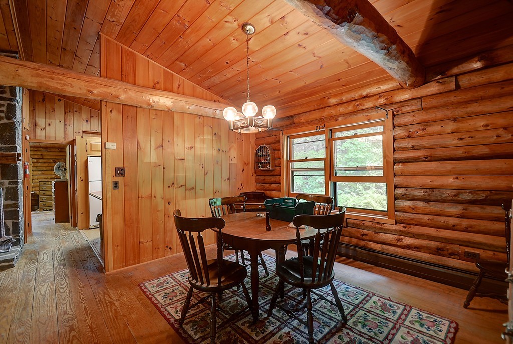 65 Allen Hill Road Holland, MA 01521 - Photo 17 of 29 a dining room with furniture and wooden floor