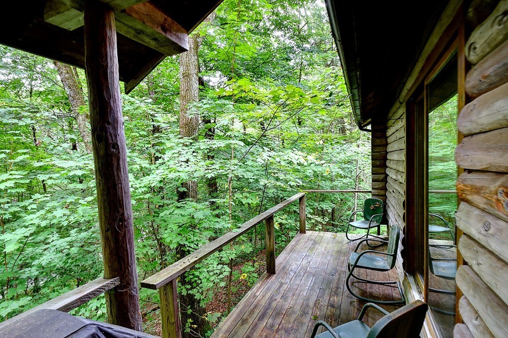 65 Allen Hill Road Holland, MA 01521 - Photo 2 of 29 a view of a balcony with wooden floor and outdoor seating