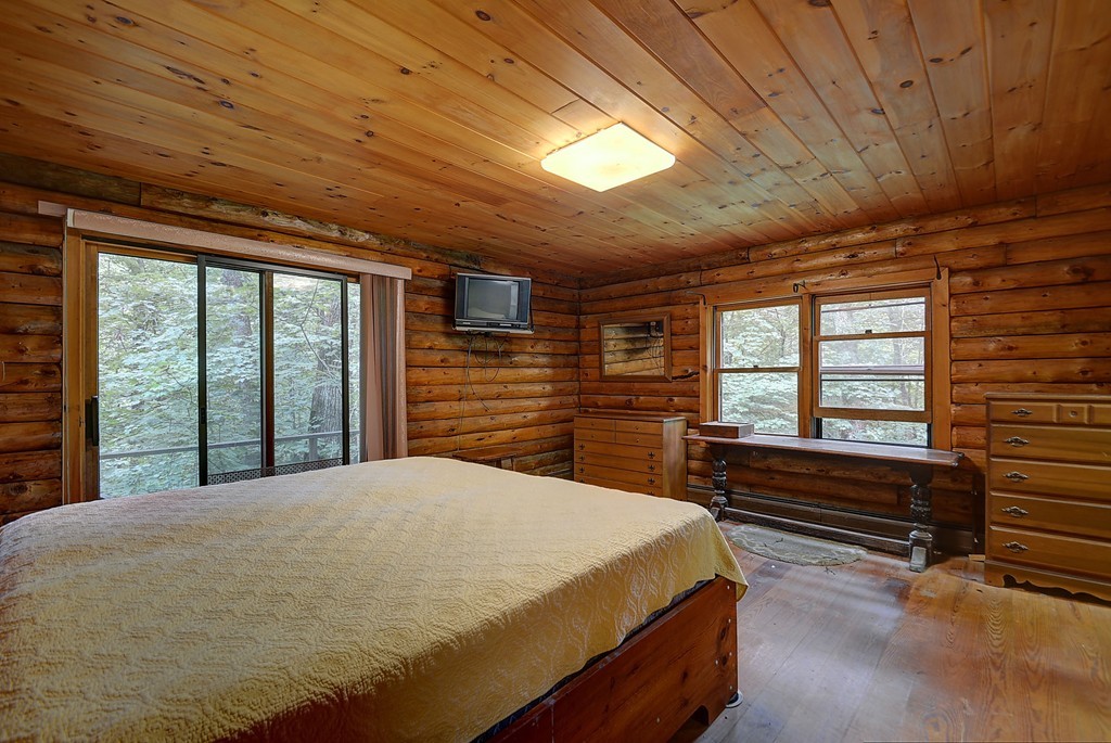 65 Allen Hill Road Holland, MA 01521 - Photo 21 of 29 a bed sitting in a spacious bedroom next to a window