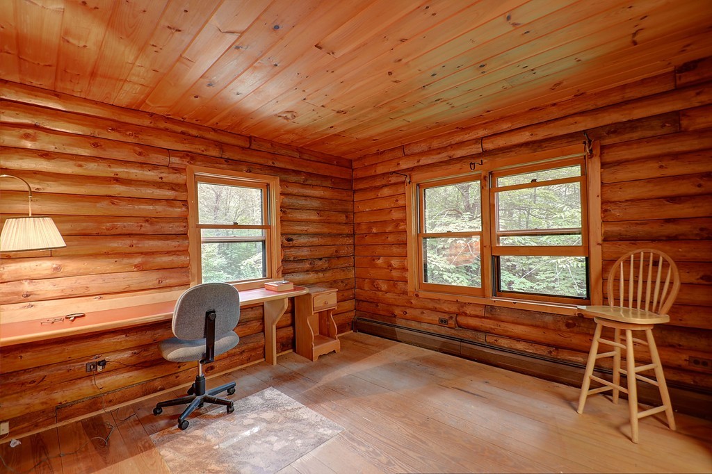 65 Allen Hill Road Holland, MA 01521 - Photo 25 of 29 a view of a workspace with furniture and a window