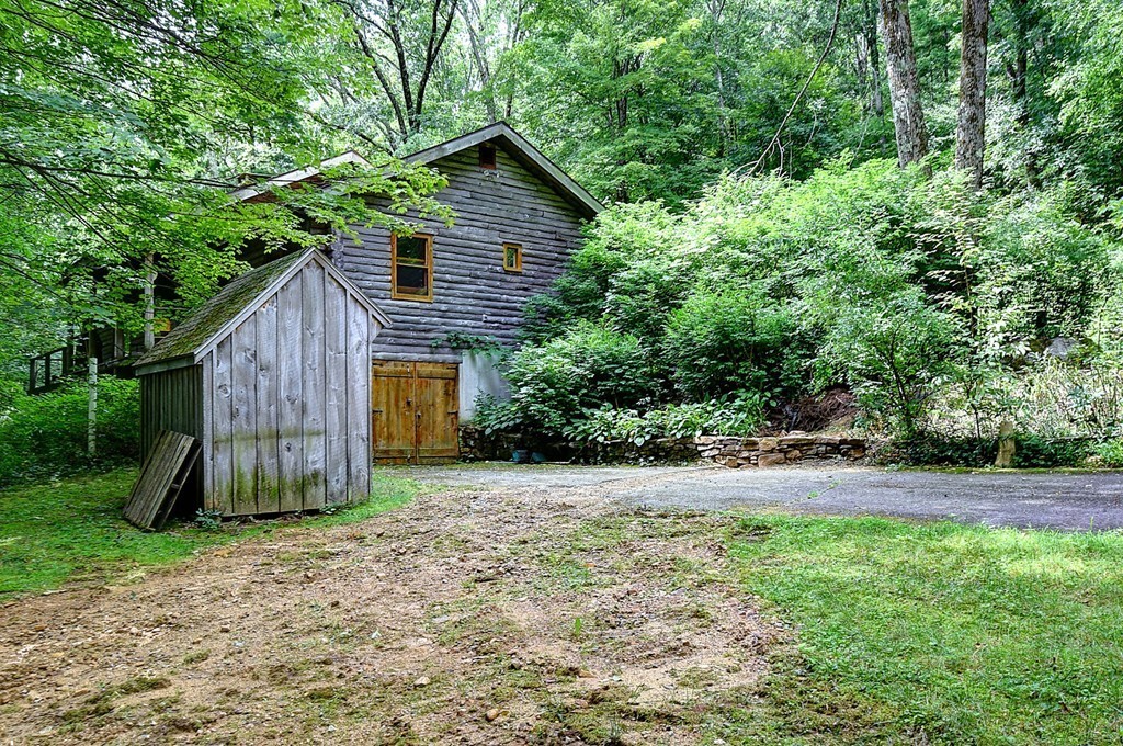 65 Allen Hill Road Holland, MA 01521 - Photo 5 of 29 a view of a house with backyard and trees