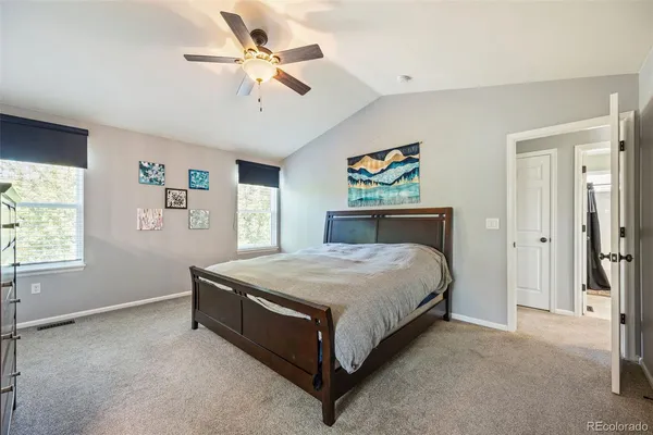 a bedroom with a bed dresser and a window