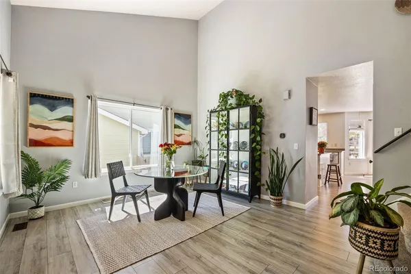 a workspace room with furniture and wooden floor