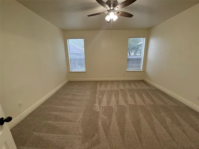 a spacious bathroom with a double vanity sink a mirror and a shower