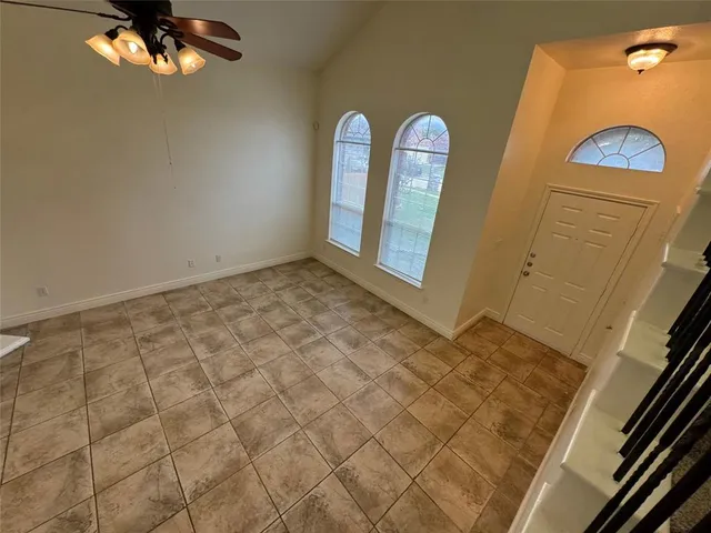 a view of living room with furniture and a fireplace