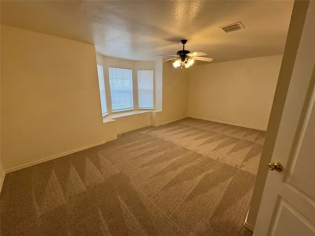 a bathroom with a double vanity sink a mirror and a bathtub