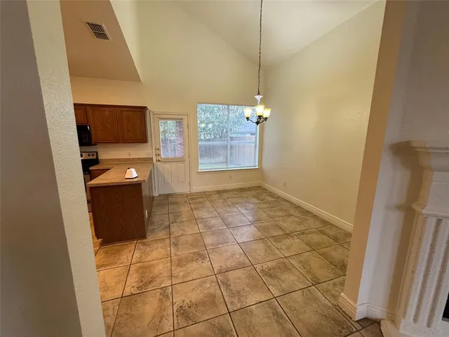 a kitchen with stainless steel appliances a stove a sink and a counter top space