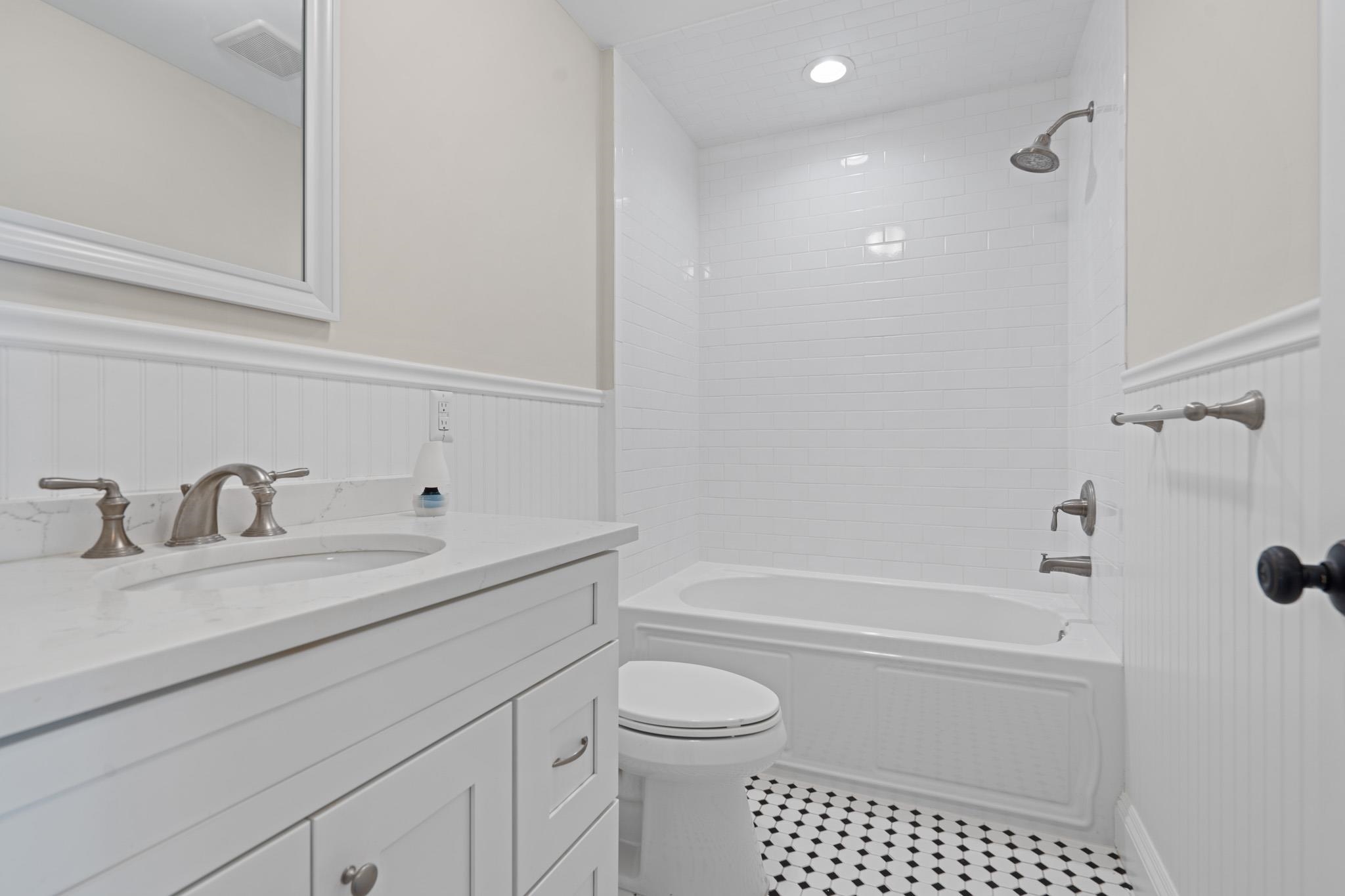 4 Central Avenue, Unit D Caldwell, NJ 07006 - Photo 12 of 32 a bathroom with a sink a toilet and shower