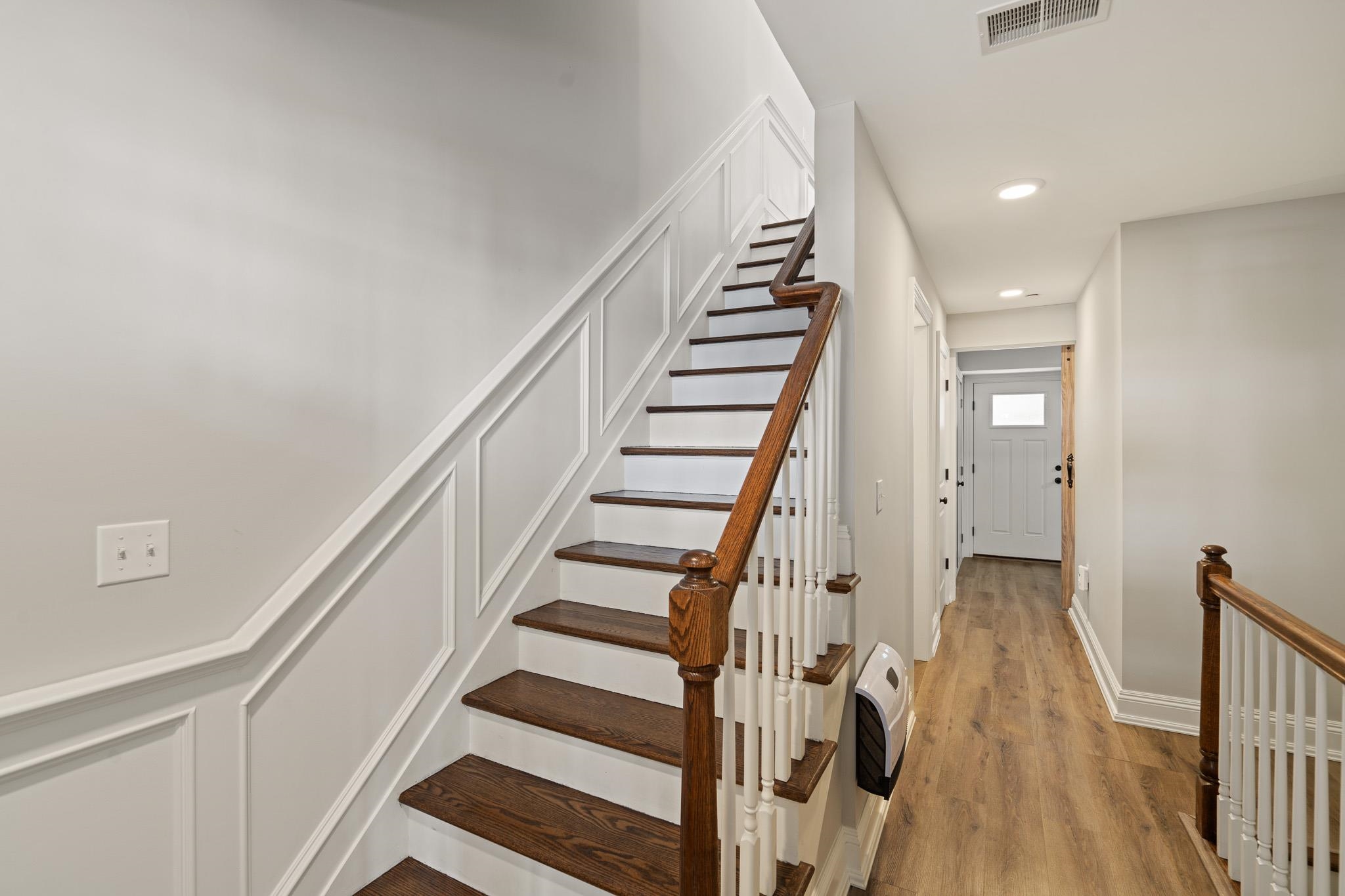 4 Central Avenue, Unit D Caldwell, NJ 07006 - Photo 20 of 32 a view of staircase with wooden floor and white walls