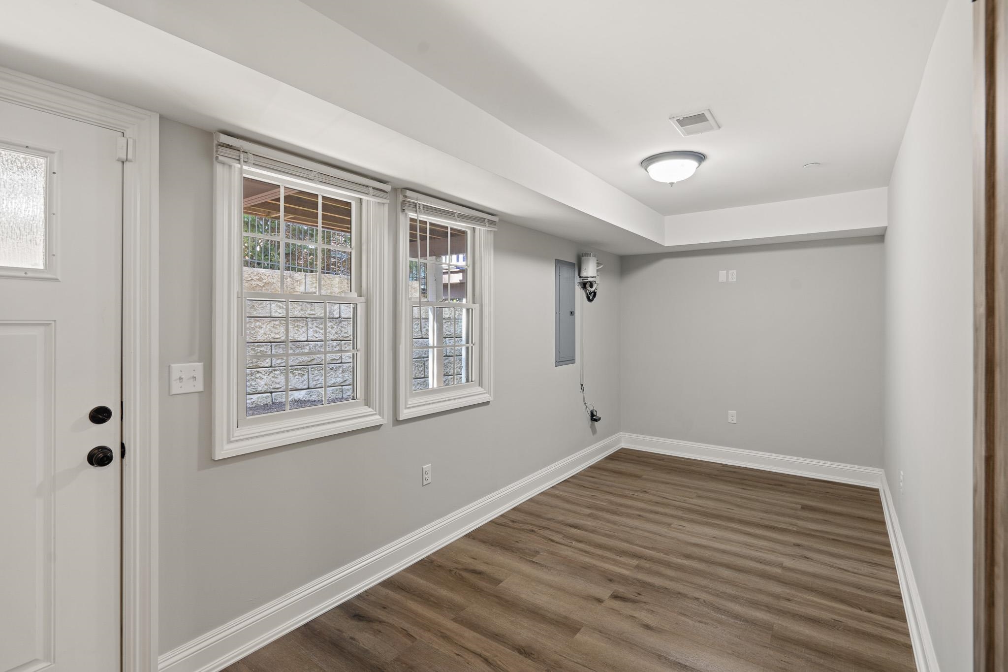 4 Central Avenue, Unit D Caldwell, NJ 07006 - Photo 22 of 32 a view of an empty room with wooden floor and a window