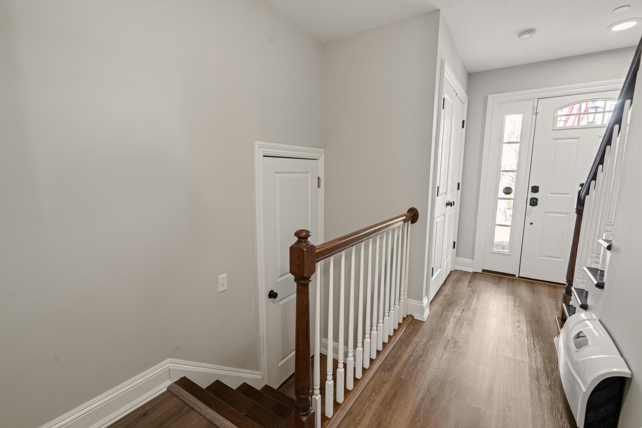 4 Central Avenue, Unit D Caldwell, NJ 07006 - Photo 23 of 32 a view of a hallway with wooden floor and staircase