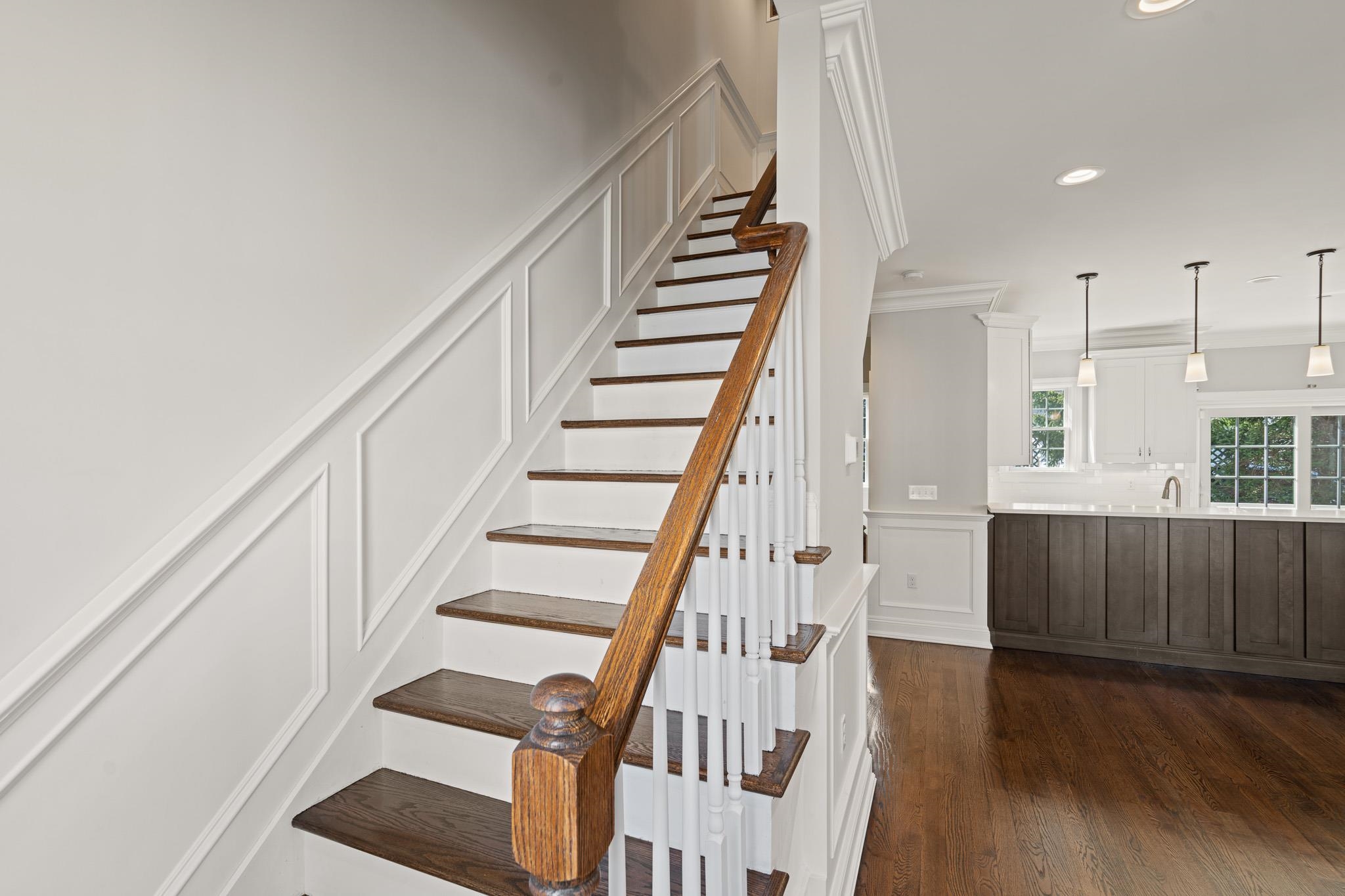 4 Central Avenue, Unit D Caldwell, NJ 07006 - Photo 26 of 32 a view of staircase with wooden floor and white walls