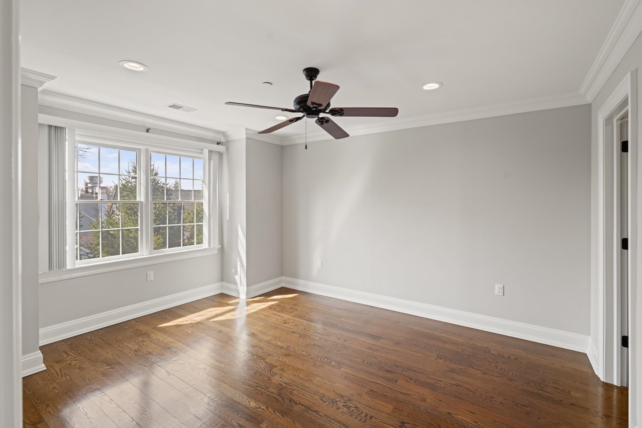 4 Central Avenue, Unit D Caldwell, NJ 07006 - Photo 8 of 32 a view of a livingroom with a ceiling fan and window