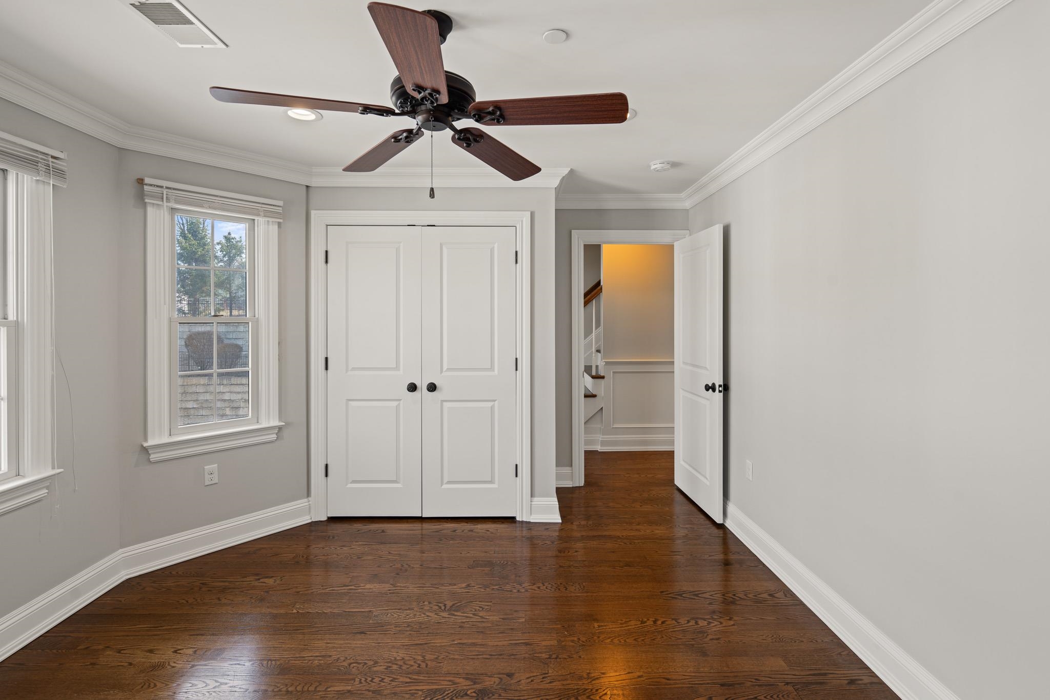 4 Central Avenue, Unit D Caldwell, NJ 07006 - Photo 10 of 32 a view of empty room with wooden floor and fan