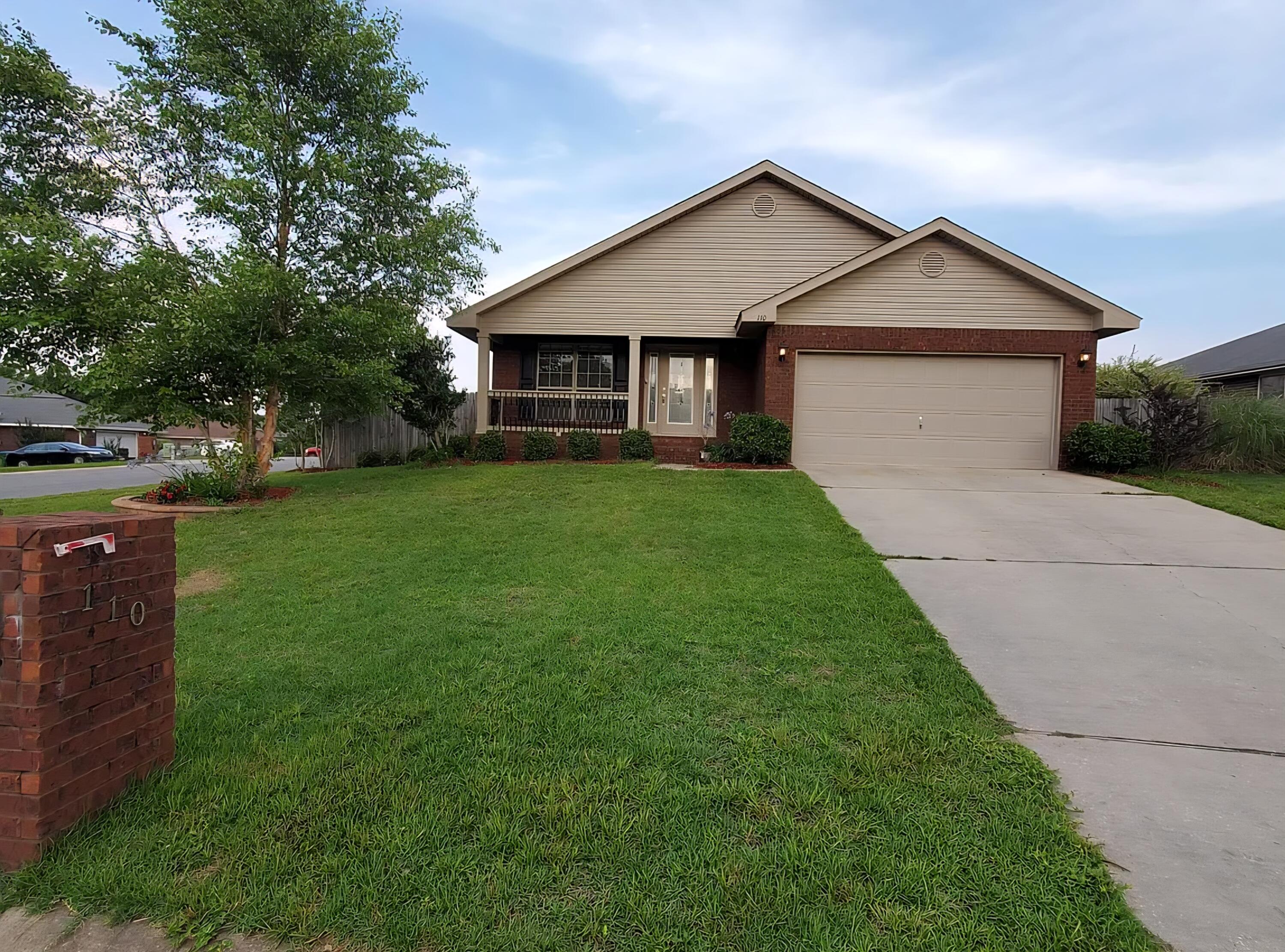 110 Bronze Circle Crestview, FL 32539 - Photo 1 of 12 a front view of a house with yard
