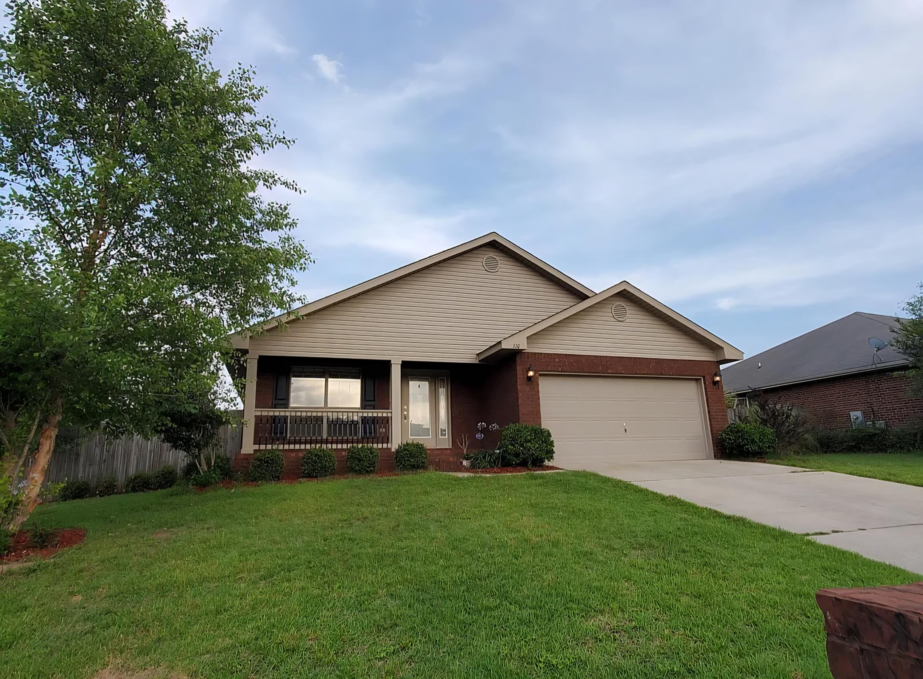 110 Bronze Circle Crestview, FL 32539 - Photo 2 of 12 a front view of house with yard and green space
