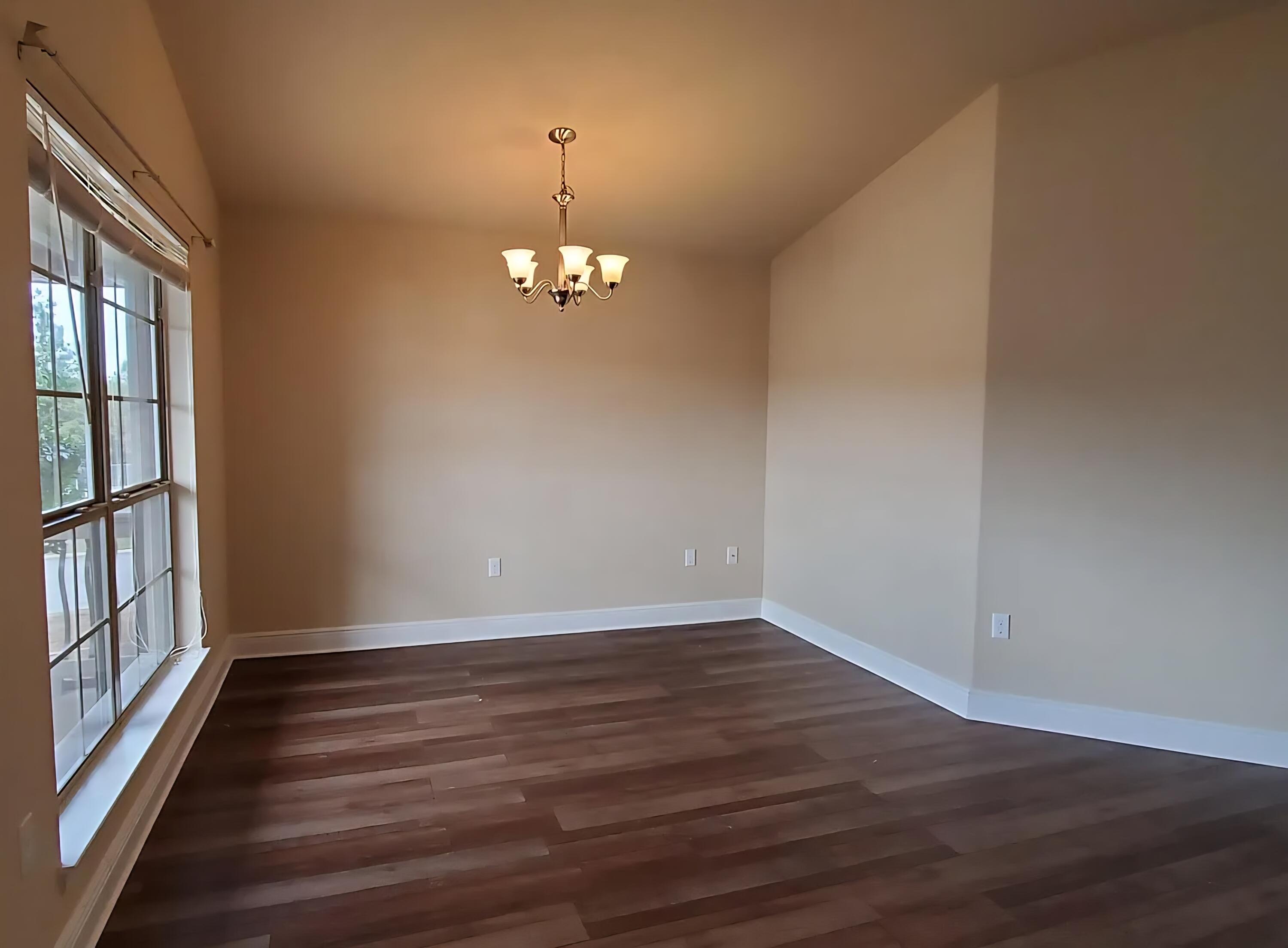 110 Bronze Circle Crestview, FL 32539 - Photo 5 of 12 wooden floor in an empty room with a window