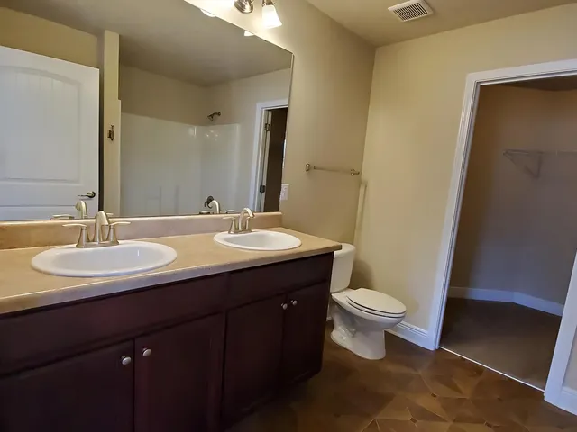 a bathroom with a sink and a toilet
