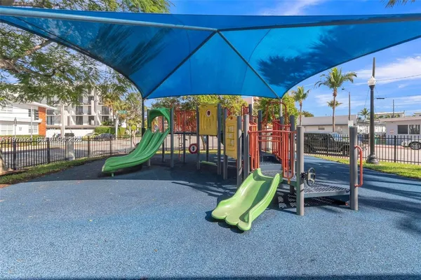 a view of a park with a slide
