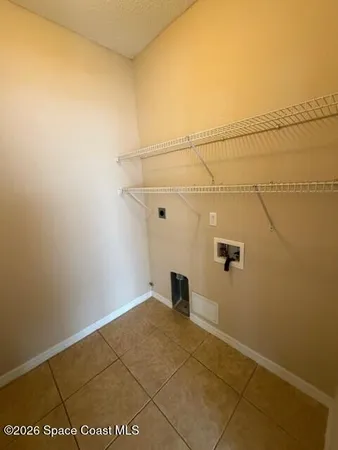 a view of a room with rack on the wall