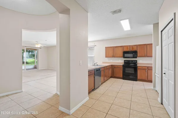 a kitchen with a refrigerator a stove and a sink