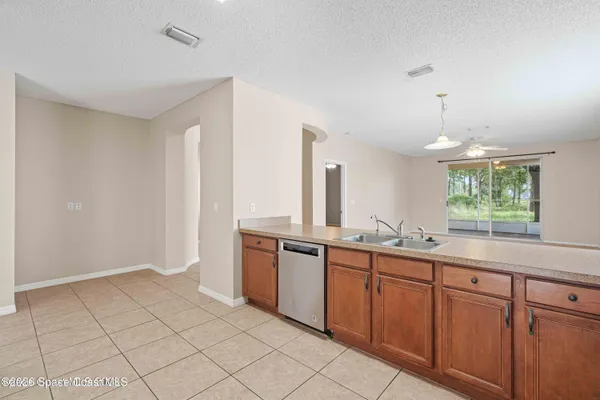 a spacious bathroom with a granite countertop sink and a mirror