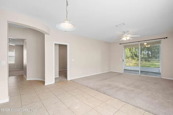 a view of an empty room with glass door