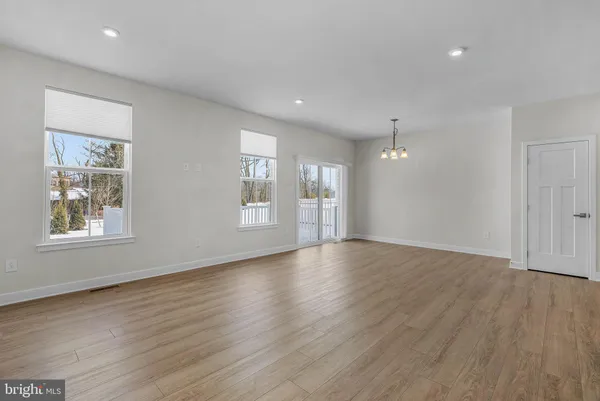 a view of kitchen with wooden floor and window